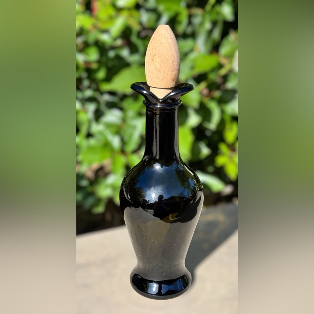 Tulip shaped dark green oil/vinegar cruet with wooden stopper
